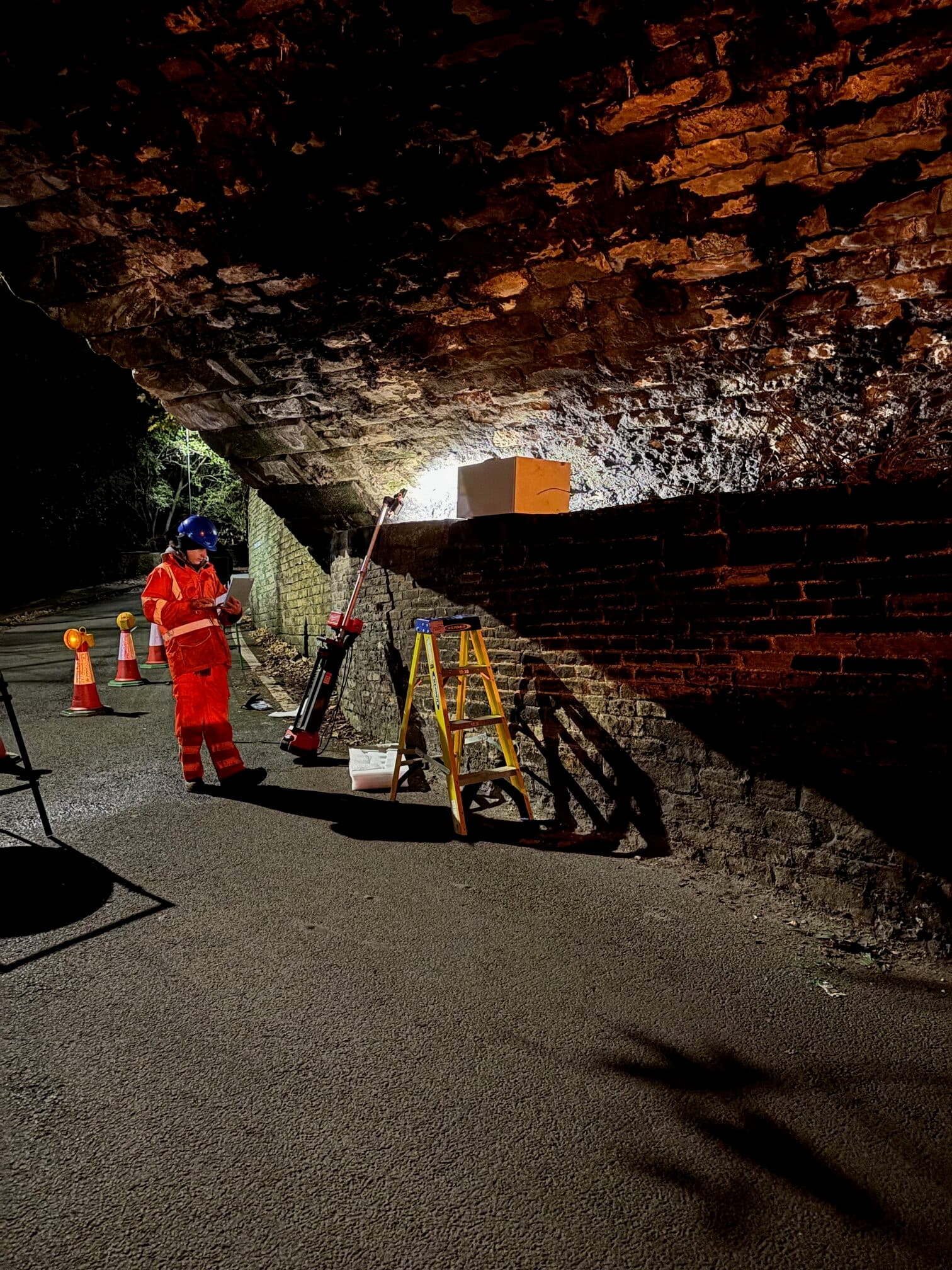Muon detectors mounted beneath a railway viaduct arch